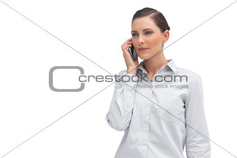 Serious businesswoman with cellphone