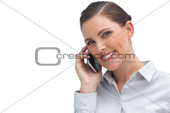 Smiling business woman talking on mobile phone