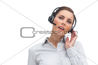 Businesswoman touching her headset