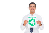 Happy businessman showing a paper with environmental awareness sign