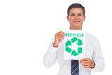 Businessman showing a paper with environmental awareness sign