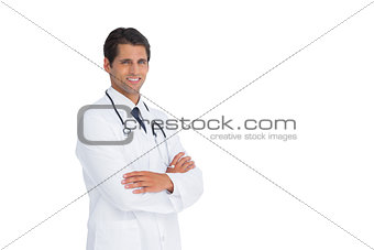 Handsome doctor smiling with arms crossed