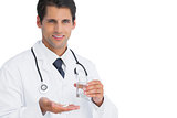 Happy doctor holding tablets and water
