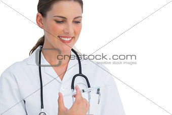 Happy nurse holding a syringe