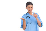 Happy surgeon holding medicine and glass of water
