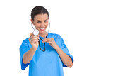 Surgeon holding up stethoscope and smiling at camera