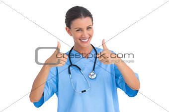 Surgeon smiling with thumbs up