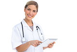 Smiling nurse using tablet pc