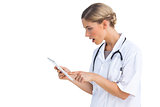 Side view of surprised nurse with tablet pc