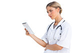 Confused nurse holding tablet pc