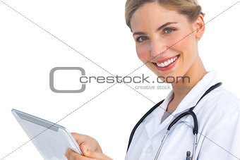 Smiling nurse with tablet pc