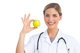 Nurse showing apple