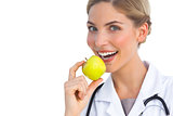 Nurse showing green apple