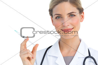 Smiling nurse with syringe