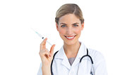 Cheerful nurse holding syringe