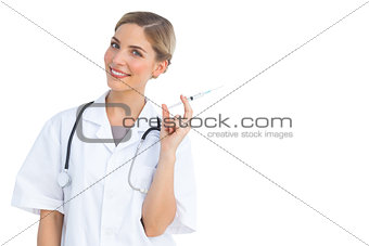 Smiling nurse preparing syringe