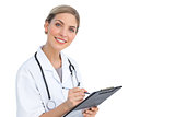 Smiling nurse with clipboard