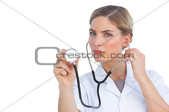 Nurse listening with stethoscope