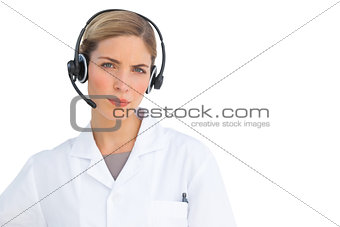 Serious nurse using headset
