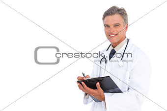 Smiling doctor with clipboard