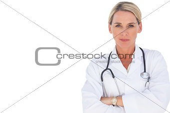 Doctor smiling with her arms crossed