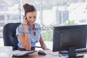 Happy businesswoman calling