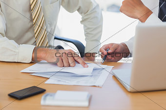 Businessmen going over paperwork