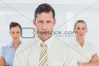 Boss standing in front of business team