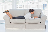 Business woman lying on couch