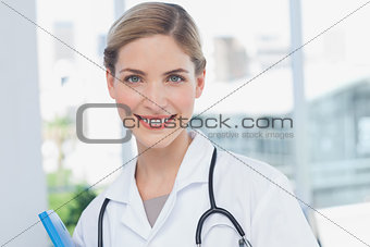 Young nurse holding a folder