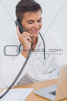 Attractive doctor on the phone