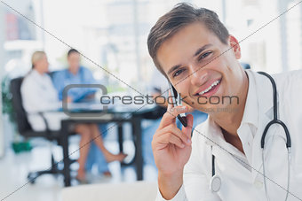 Smiling doctor calling