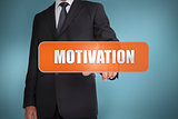 Businessman selecting the word motivation