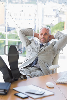 Businessman relaxing at his desk