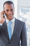 Smiling businessman on a call