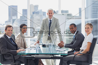 Cheerful team of business people in the meeting room