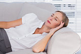 Businesswoman sleeping on couch