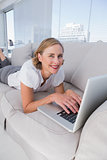 Relaxed businesswoman using her laptop