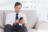 Businessman sitting on couch