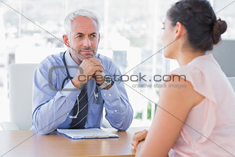 Concentrated doctor listening to patient