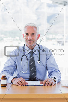 Handsome doctor sitting