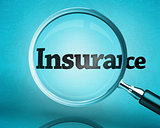 Magnifying glass showing the word insurance
