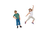 Happy little boy and girl jumping