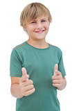 Smiling young boy with a green shirt