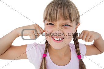 Little girl tensing her arm muscles