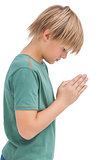 Little boy praying with bowed head