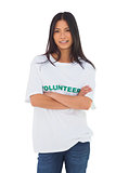 Attractive volunteer with arms crossed