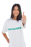 Cheerful volunteer woman with thumb up
