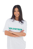 Woman wearing volunteer tshirt with arms crossed