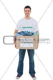 Handsome man carrying donation box